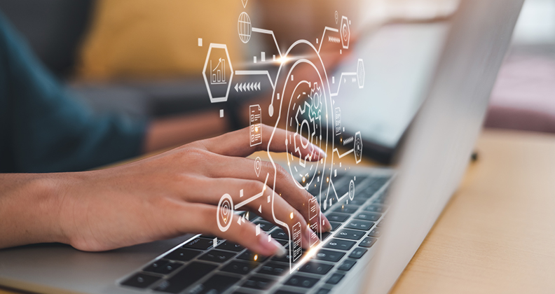 Woman typing in an laptop with data graphics emerging form the keyboard
