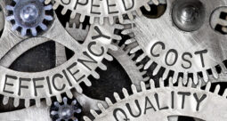 Concept art showing gears with the words efficiency, cost and quality