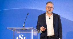 Dr. David Kirschman standing at a podium