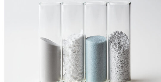 Four clear capsules containing Himed powders used in 3D printing
