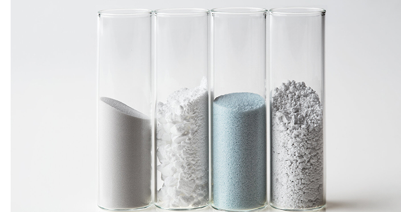 Four clear capsules containing Himed powders used in 3D printing