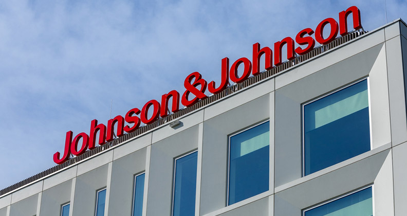 J&J Logo in red attached to top of corporate building