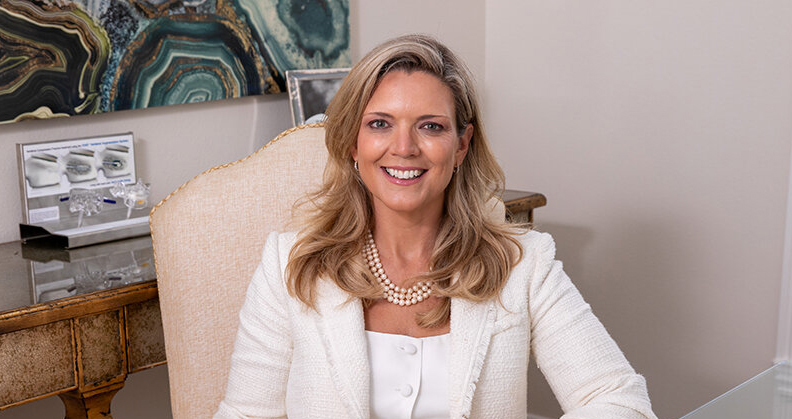 Alyssa Huffman sitting at her home office desk