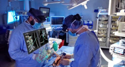 Two surgeons operating with Medivis spine navigation platform