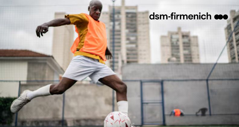 Fit man kicking a soccer ball