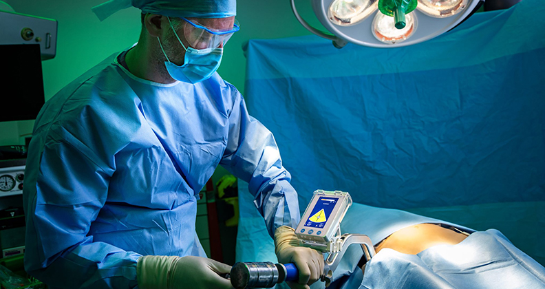 Surgeon operating with Gyder Hip device