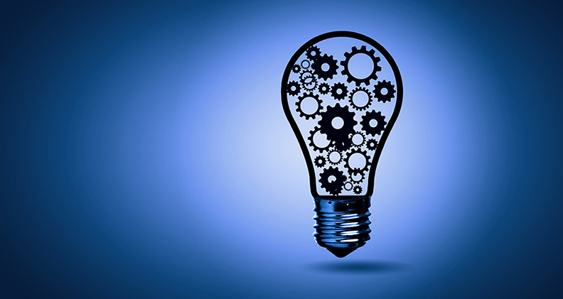 Concept art showing a lightbulb containing gears against a dark blue background