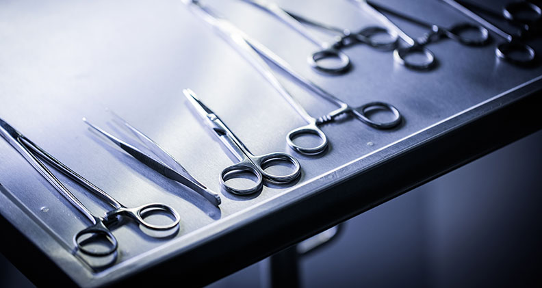 Surgical instruments on a stainless steel tray
