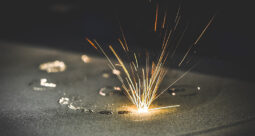 Sparks flying in a laser 3D printing bed